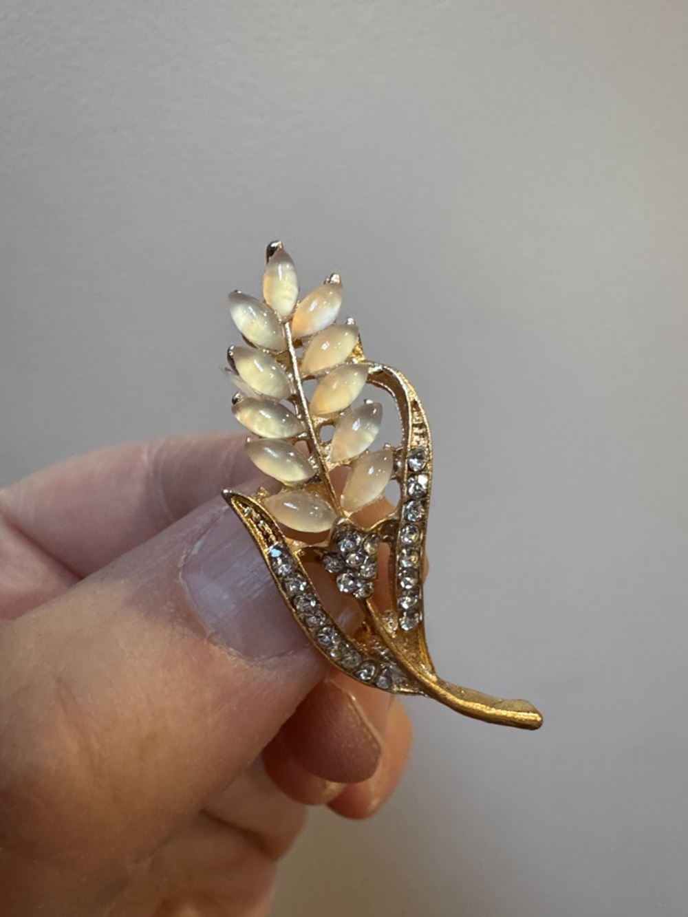 Gold-Tone Opalescent Leaf Brooch with Clear Crystal Accents